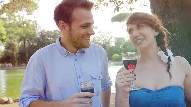 young people drinking red wine