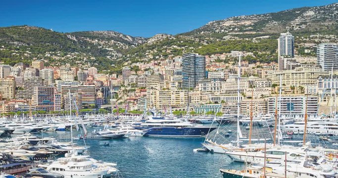 World Fair MYS Monaco Yacht Show, Port Hercules, luxury megayachts, many shuttles, taxi boat, presentations, Journalists, boat traffic, Azur water, aerial view, mountains on background, perspective