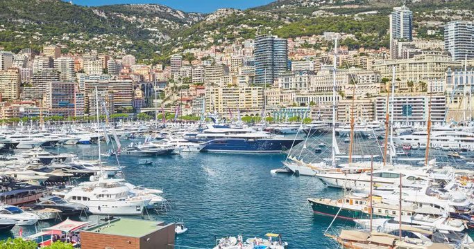 World Fair MYS Monaco Yacht Show, Port Hercules, luxury megayachts, many shuttles, taxi boat, presentations, Journalists, boat traffic, Azur water, aerial view, mountains on background, perspective