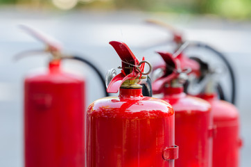 Red tank of fire extinguisher - obrazy, fototapety, plakaty