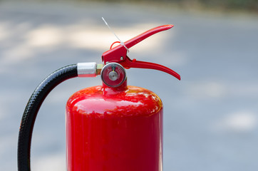 Red tank of fire extinguisher