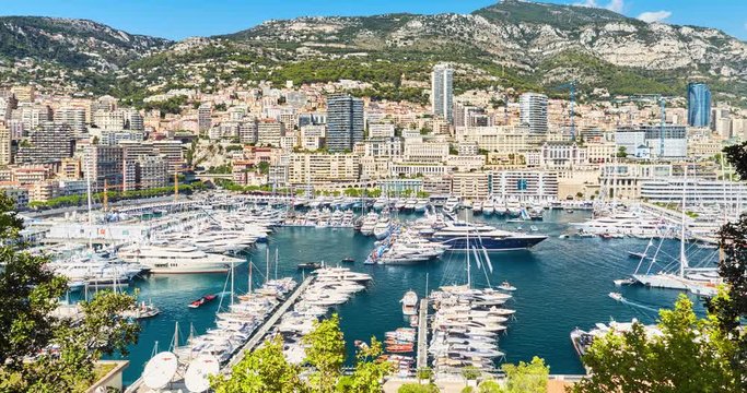 Timelapse of World Fair MYS Monaco Yacht Show, Port Hercules, luxury megayachts, big boat, sunny day, many shuttles, taxi boat, presentations, Journalists, zoom effect, boat traffic, Azur water,