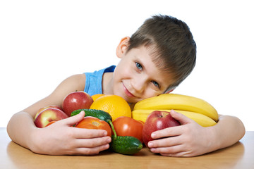 Fototapeta na wymiar Happy healthy boy with fruits and vegetables isolated
