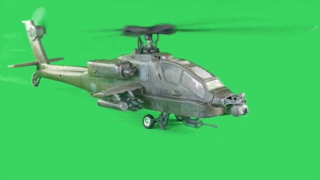 Military gunship flying on greenscreen, turning
