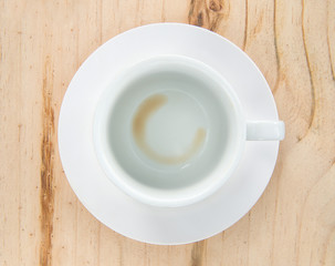 Fototapeta na wymiar Empty coffee cup after drink on wood table