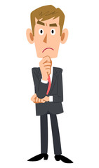 スーツを着用した茶髪のビジネスマンが考える
