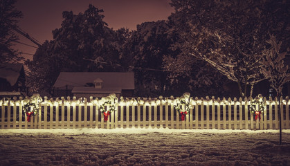 Seasonal Christmas Decoration on white fence