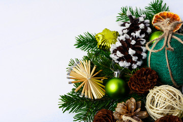Christmas greeting with straw stars, pine cones and rustic twine