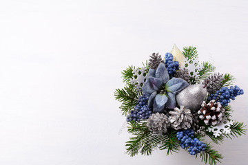 Christmas background with silver glitter decor and blue silk poi
