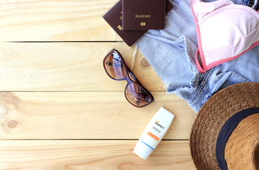travel concept. set of women's accessories seen from above with free text space. summer holiday. over light 
