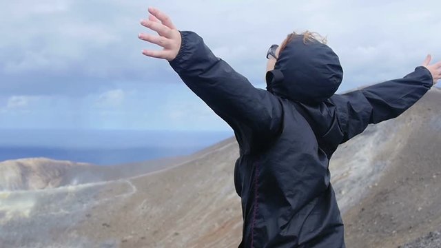 young woman near a crater of a volcano: Sicily, Italy, Eolie