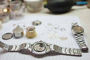 Detail of watch machinery on the table.