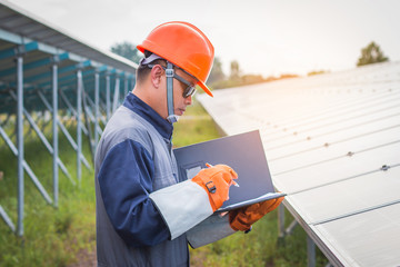 an engineer working on checking equipment in solar power plant