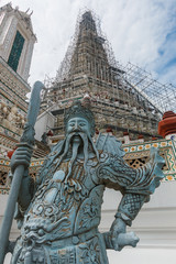 Obraz premium Statue Chinese ,The Chinese Stone Figurines of Wat Arun is a Buddhist temple in Bangkok Yai district of Bangkok, Thailand, on the Thonburi west bank of the Chao Phraya River.