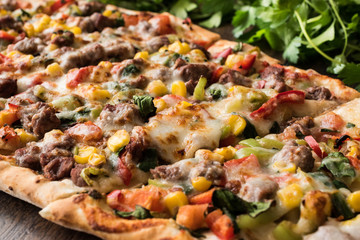 Turkish Pide with meat and vegetables.