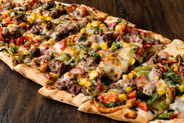 Turkish Pide with meat and vegetables.