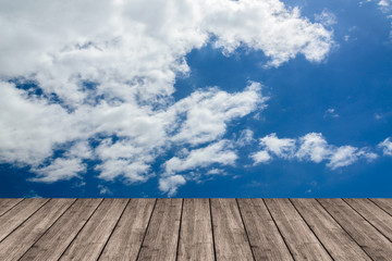 Wooden table or terrace on Deep blue sky and clouds. Space for y