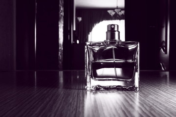 Men's perfume in a glass container.