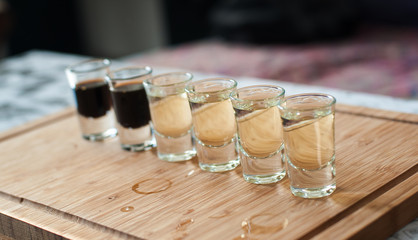 Brandy in shot glasses lined up in a row