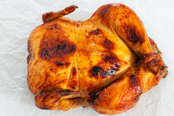 delicious whole chicken roasted in oven on parchment paper