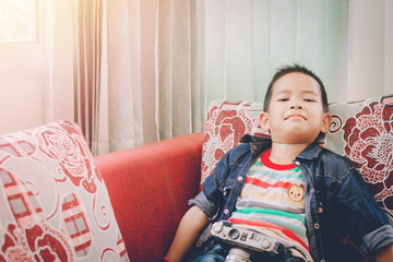 Kid studying photography with old camera  favorite in the house.