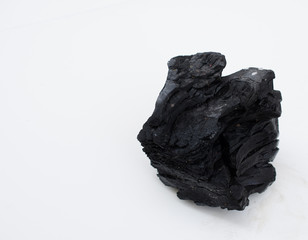 Pile of coal isolated on white background.