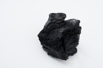 Pile of coal isolated on white background.