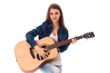 brunette woman with guitar in hands