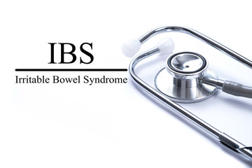 Page with IBS (Irritable Bowel Syndrome) on the table with steth