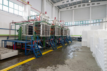 an industrial workshop for the production of styrofoam shapes for packaging