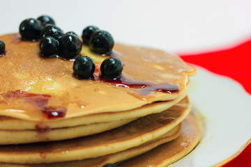 Pancake with black currant and liquid honey