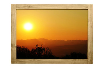Sunset image in wooden frame vintage color.