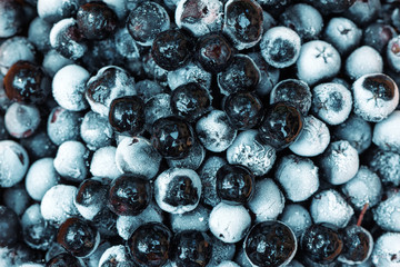 Frozen aronia chokeberry berries in a bowl