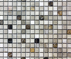 abstract mosaic of small tiles of brown and gray