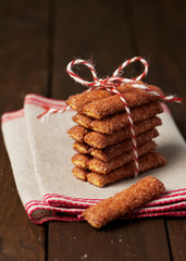 Homemade cinnamon sticks cookies with festive baker's twine. Christmas present.