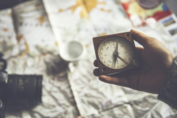 travel concept: girl with a compass
