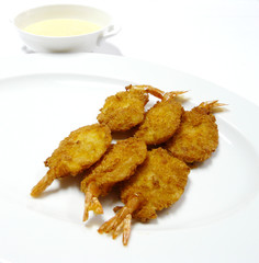 chinese food - deep fried shrimp with cream sauce in white dish
