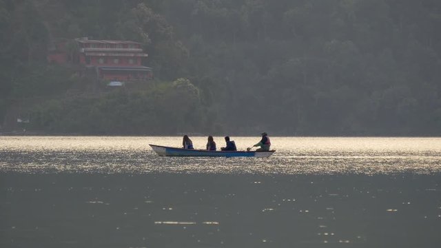 Boat in a glare of sunset