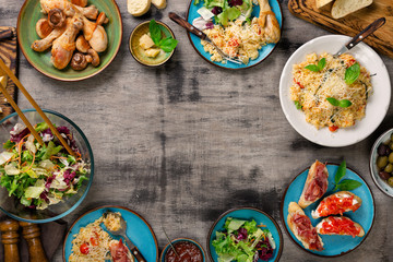 Frame of risotto, roasted chicken legs and snacks
