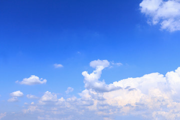 Naklejka na ściany i meble Blue sky background with white clouds and rain clouds. The vast blue sky and clouds sky on sunny day. White fluffy clouds in the blue sky.