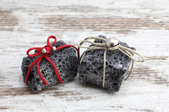 Christmas coal in a wood background