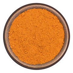 Organic cayenne powder in ceramic bowl isolated on white background, top view