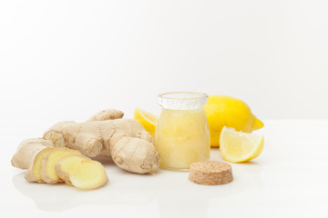 cosmetics homemade lemon, ginger  on white wooden table