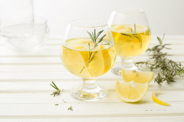 Lemonade with fresh lemon on white