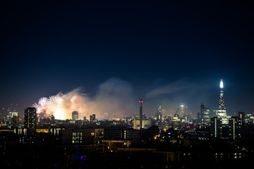Fototapeta na wymiar Beautiful fireworks above London. New Years Eve, view from Greenwich Point Hill 