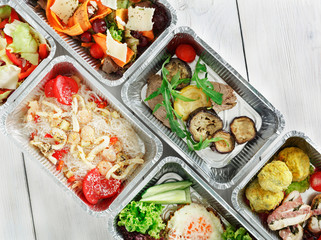 Healthy food take away, top view at wood background