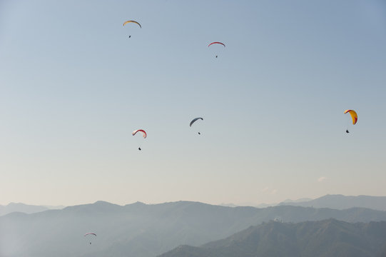 Paragliders flying above Pokhara, Nepal, Himalayas
