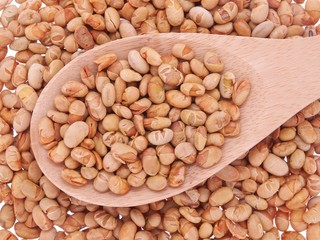 roasted soybeans in wooden spoon