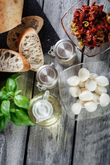 Ingredients ready for preparing bruschetta with sun-dried tomato