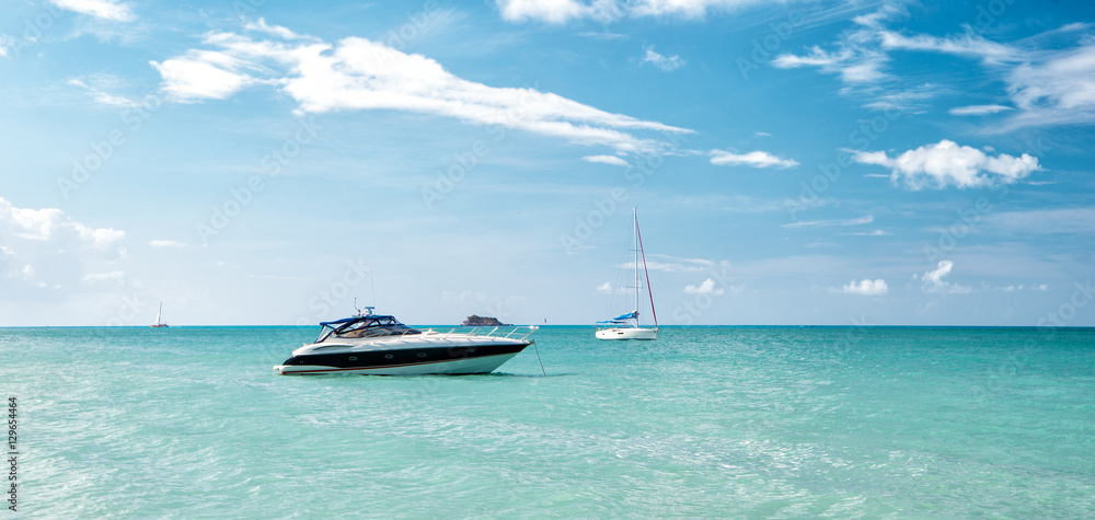 Wall mural attractive bright view of exotic colorful beautiful marine beach with boat on blue water